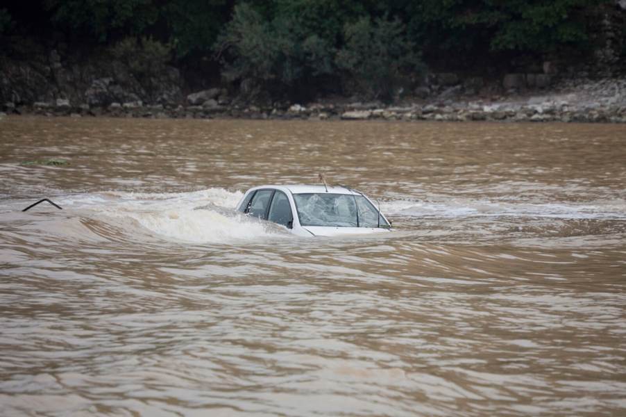 A driver will have to file a claim with their car insurance provider after their vehicle has flood damage.