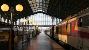 Narrow French train station with a new passenger line inside.