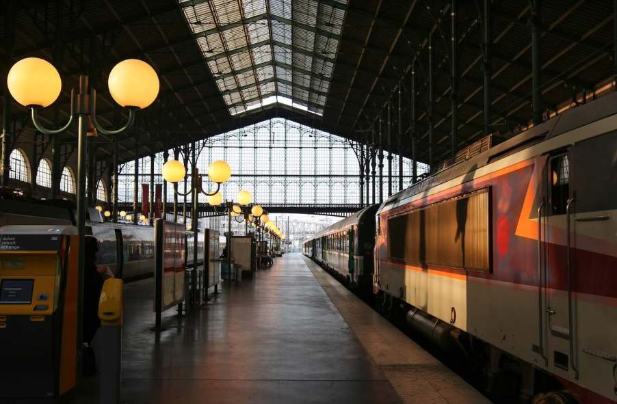 Narrow French train station with a new passenger line inside.