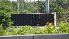 Semi truck rollover after a crash on the highway.