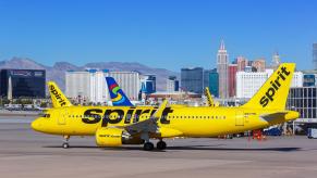 A Spirit Airlines flight on the runway before takeoff.