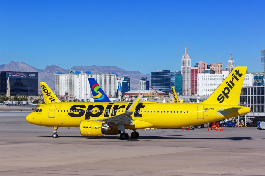 A Spirit Airlines flight on the runway before takeoff.