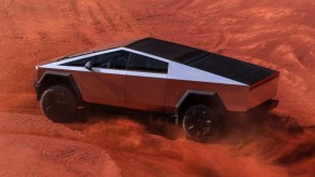 The Tesla Cybertruck off-roading through sand