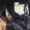 The charred cab of a truck after a bad fire.