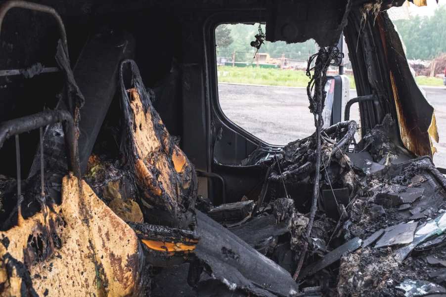 The charred cab of a truck after a bad fire.