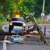 A truck at the scene of a downed power line