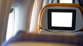 Blank in-flight entertainment screens on an airplane