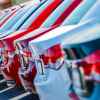 New car lot showing a row of cars photographed in close right rear angle