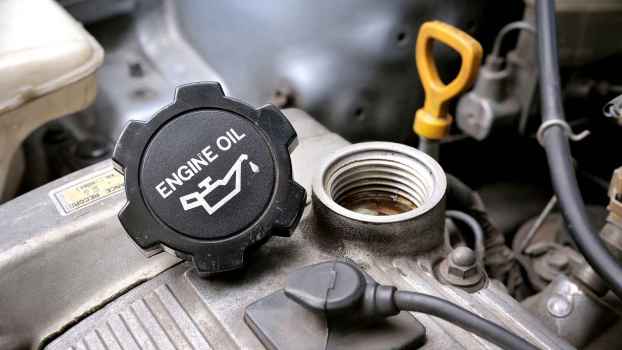 An engine oil cap left off with block smoking after an oil change